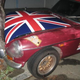 Illustration for article titled Olde English 800-Fueled Driver Obliterates Union Jack-Adorned MGB-GT, We Struggle To Find Meaning